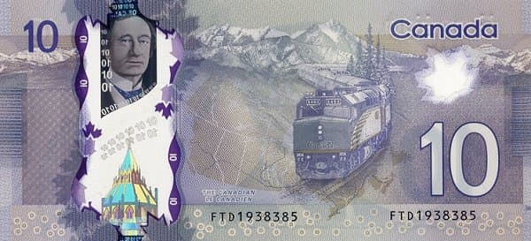 Поезд, железнодорожный мост и канадский пейзаж.